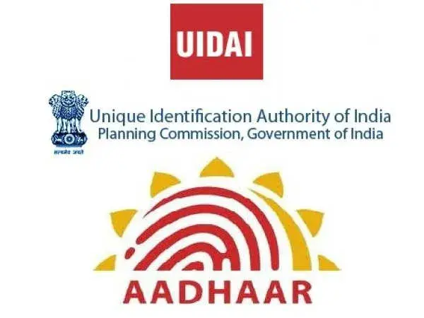 UIDAI logo with India's emblem text. Below, Aadhaar logo features a red fingerprint sunburst. Text: "Unique Identification Authority."