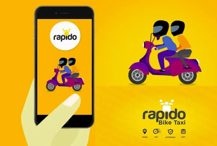 A smartphone displays the Rapido app featuring two helmeted figures on a scooter. Background is bright yellow. Text reads "Rapido Bike Taxi".