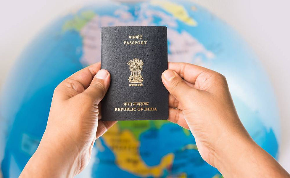 Hands holding an Indian passport in front of a blurred globe, suggesting travel. Blue and yellow colors dominate the background.