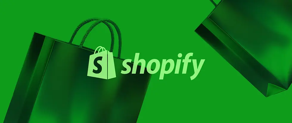 Green image with two shopping bags and the text "Shopify" in large white letters. The logo is visible on one bag. Bold, modern design.
