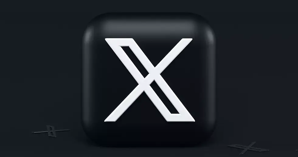 Black 3D cube with a large white letter "X" on a dark background. Two smaller "X" shapes lie flat nearby, creating a sleek, modern look.