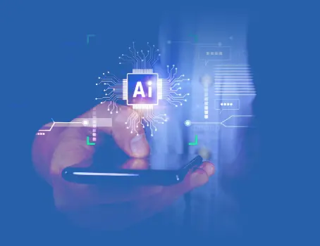 Hand holding a smartphone with "AI" symbol and digital circuit patterns. Blue-tinted background, suggesting technology and innovation.