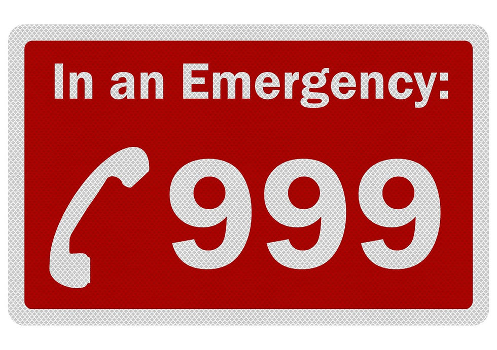 Red emergency sign with a phone icon and "In an Emergency: 999" text in white. Urgent and clear message.