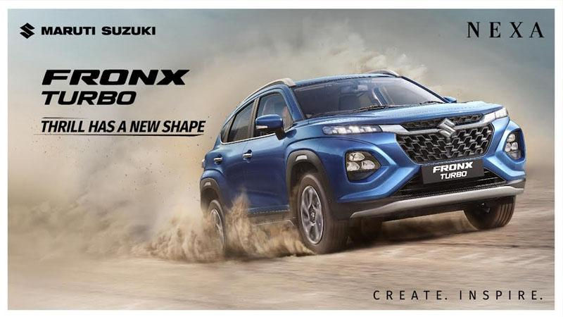 A blue Maruti Suzuki FRONX Turbo car drives through dust. Text: "Thrill Has a New Shape." Branding for Maruti Suzuki and NEXA. Mood: Dynamic.