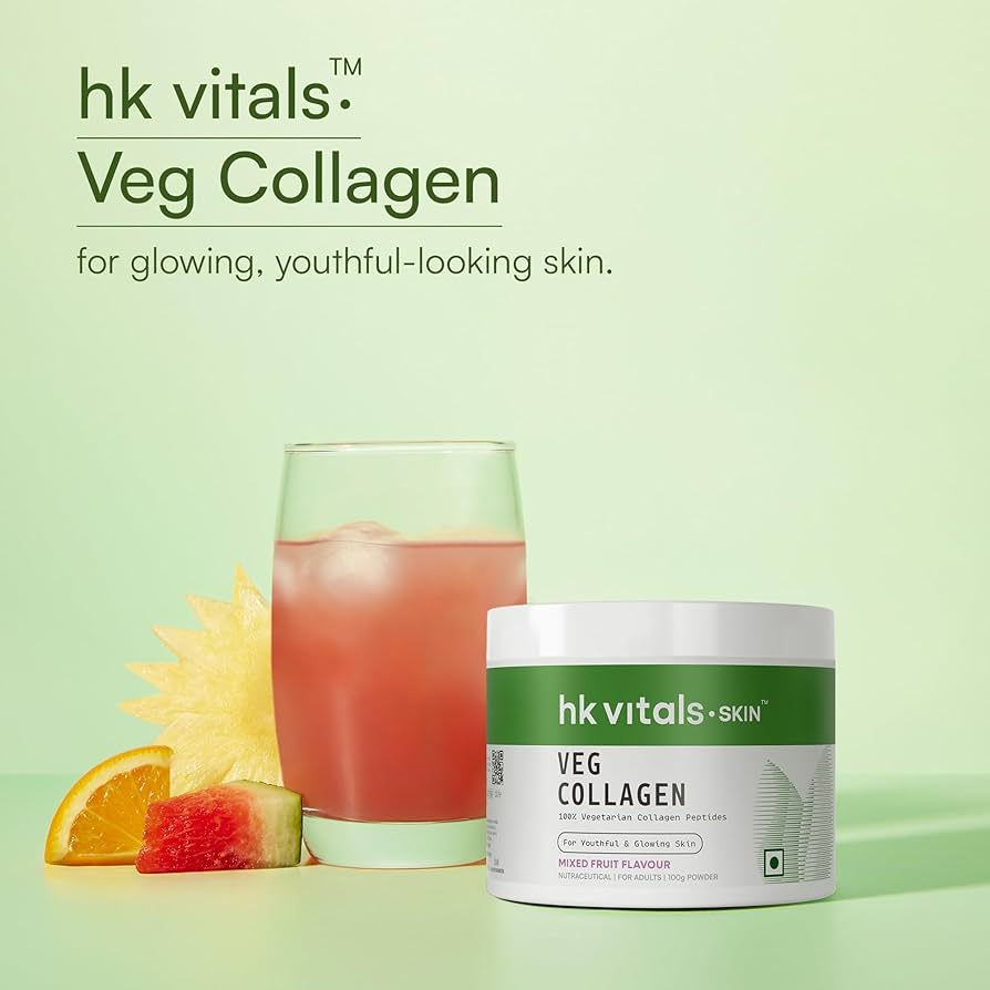 Veg Collagen jar and a glass of pink drink with fruit slices on a green background. Text: "hk vitals Veg Collagen for glowing skin."