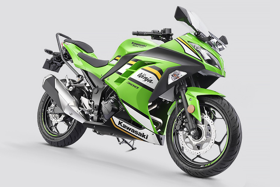 Green Kawasaki Ninja 300 motorcycle on a light gray background. Features sleek design, bold black and yellow stripes, and visible text logos.
