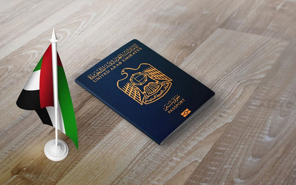 UAE passport on a wooden surface next to a small UAE flag. The passport is blue with gold text and emblem, creating a patriotic mood.