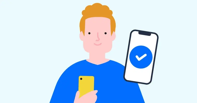 Cartoon person with yellow phone smiles, holding a screen displaying a blue checkmark. Blue shirt, light background, positive mood.
