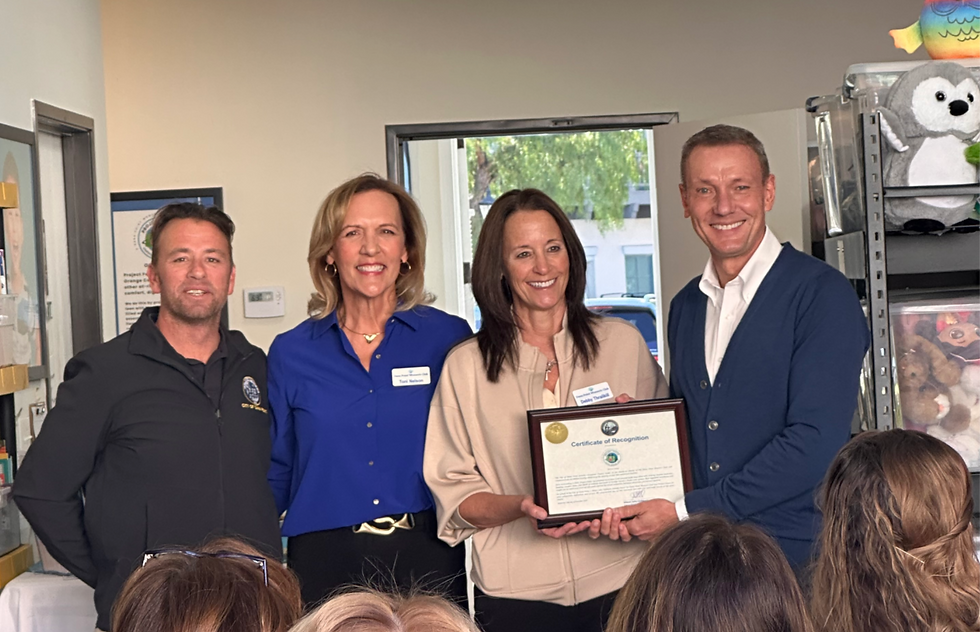 From left, Dana Point Mayor Pro Tem Mike Frost, Toni Nelson, Debby Thrailkill and Mayor John Gabbard presenting a wonderful Certificate of Recognition honoring the work of Project Foster. 
