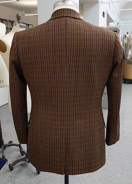 Wool Plaid Jacket Back for San Francisco Opera's Orlando. A brown wool plaid jacket with center back vent. 