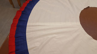Stitching a blue tier to white skirt base