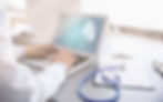 Cardiologist working with laptop at offi