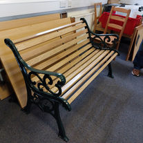 Wooden slat bench finished with green ends