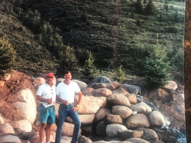 George Sanders and Jon Claus colleague celebrating building the first waterfall in the greens at Arrowhead