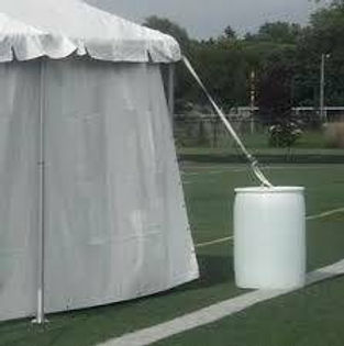Tent Rentals With Water Barrel Securing The Corner In Sterling Heights, Michigan