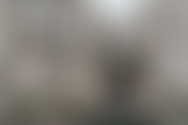 Bride and groom at The Signet Library – Victoria and William share a joyful moment, smiling together in front of the grand columns and elegant architecture of The Signet Library.