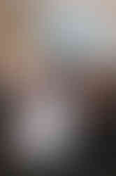 Bride and groom sharing a joyful first dance at Balbirnie House, Scotland, surrounded by glowing fairy lights.