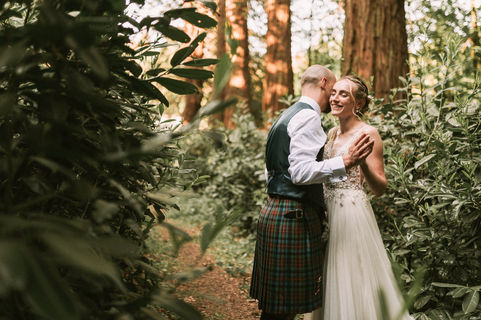 Rachel and Kevin sharing a relaxed moment during their Ballogie House wedding, photographed in a natural, candid style