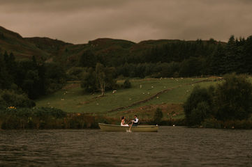 Bride and groom on the boat at Cardney Steading.