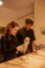 two people cooking together