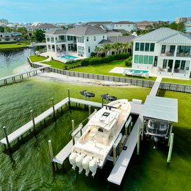 Luxury waterfront homes with private docks and boats.