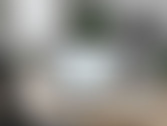 Laptop displaying payroll and time tracking data on a desk in a modern office, representing wage and hour compliance review.