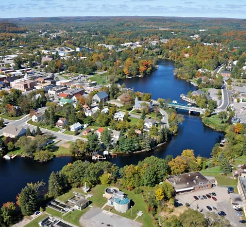 Aerial view of Huntsville, Ontario looking over the town centre, surrounding lakes, and residential neighbourhoods in Muskoka – Velora Water Systems service area for premium water filtration and softener systems