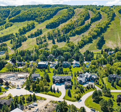 Aerial view of The Blue Mountains, Ontario showing the escarpment, village area, and surrounding residential neighbourhoods near Georgian Bay – Velora Water Systems service area for premium water filtration and softener systems