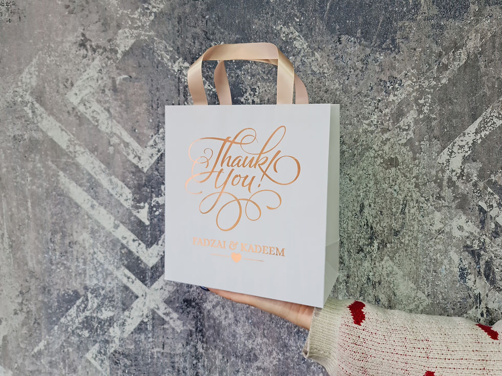 Thumbnail: Wedding welcome bags, on white paper with ROSE GOLD foil print. Hotel guest bags
