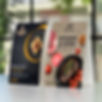 Two sets of food table-top tent cards on table