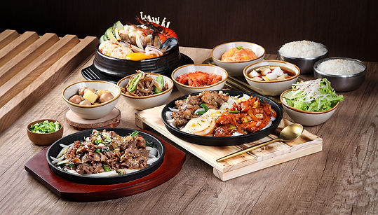 A whole spread of delicious korean delicacies on a table