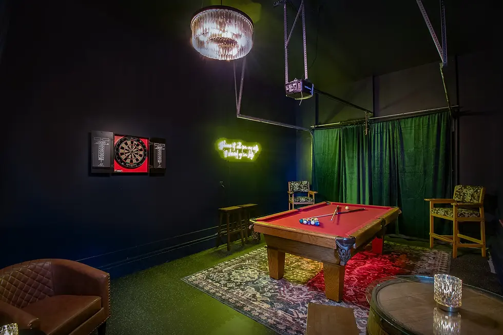 Stylish game room with red billiards table and neon lighting at vacation rental, perfect for unwinding after CMA Fest