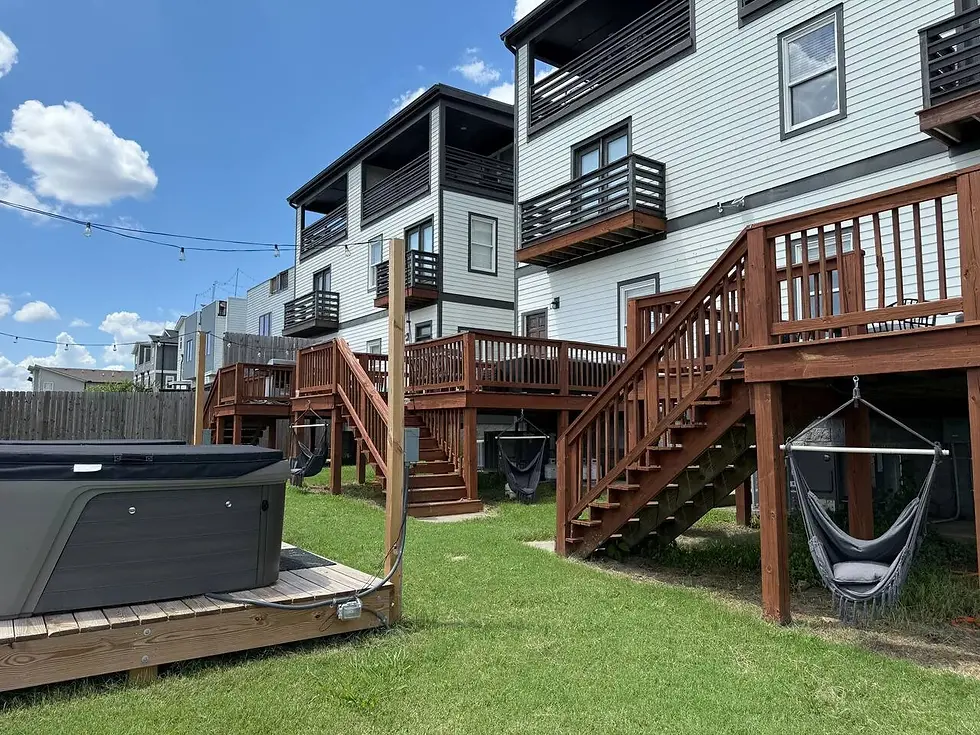 Modern multi-unit residential building with wooden decks and hot tub in Nashville outdoor entertainment space