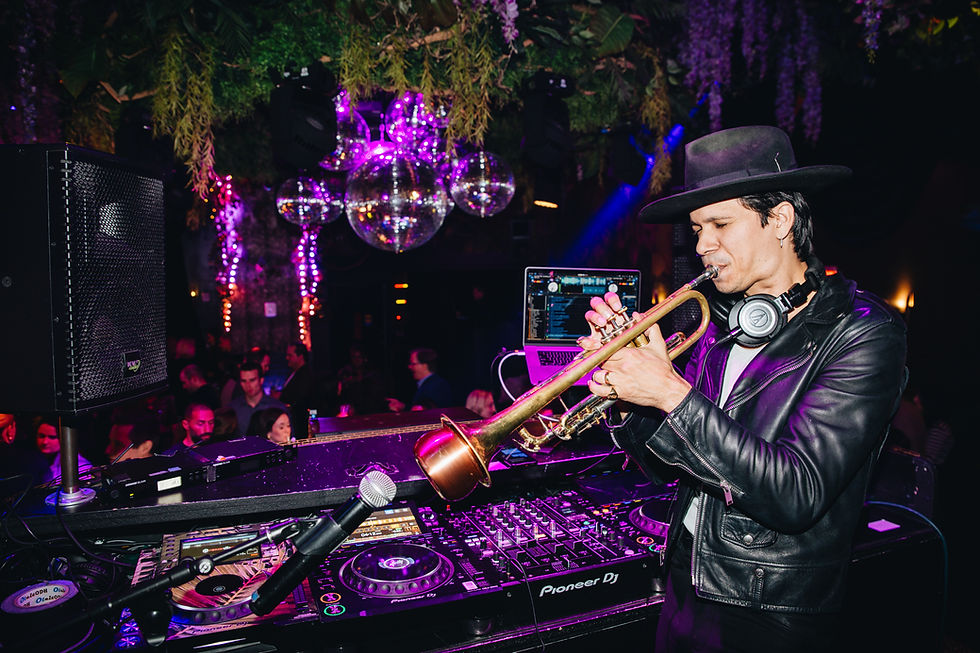 Luxury stage performance with live musicians and elegantly dressed guests enjoying the moment