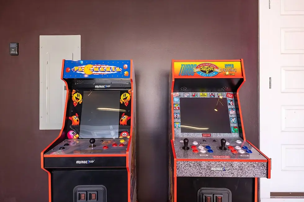 Vintage arcade cabinets in game room for Nashville vacation rental with pool table