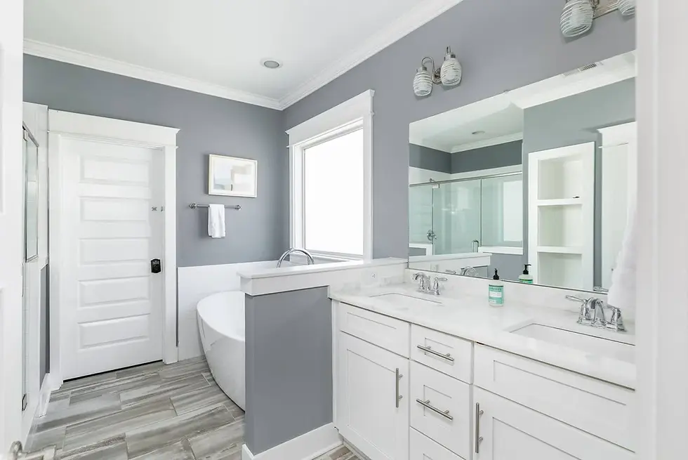 Luxury spa-like bathroom with freestanding tub, dual vanity, and marble countertops at Nashville property