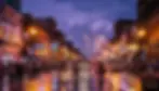 Nashville honky-tonks and live music venues on Lower Broadway at dusk with neon signs and atmospheric lighting