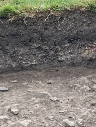 Our Stratigraphy! You can see clearly the first layer of rubble in this photo
