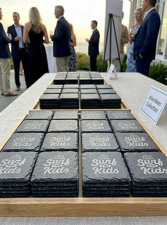 Finished personalised slate coaster fundraiser order ready for collection by attendees