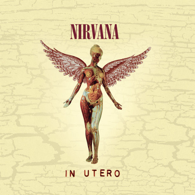 Nirvana's In Utero album cover featuring the iconic anatomical winged female mannequin standing against a distressed cream-colored background, with the band name "Nirvana" at the top and the album title "In Utero" at the bottom.