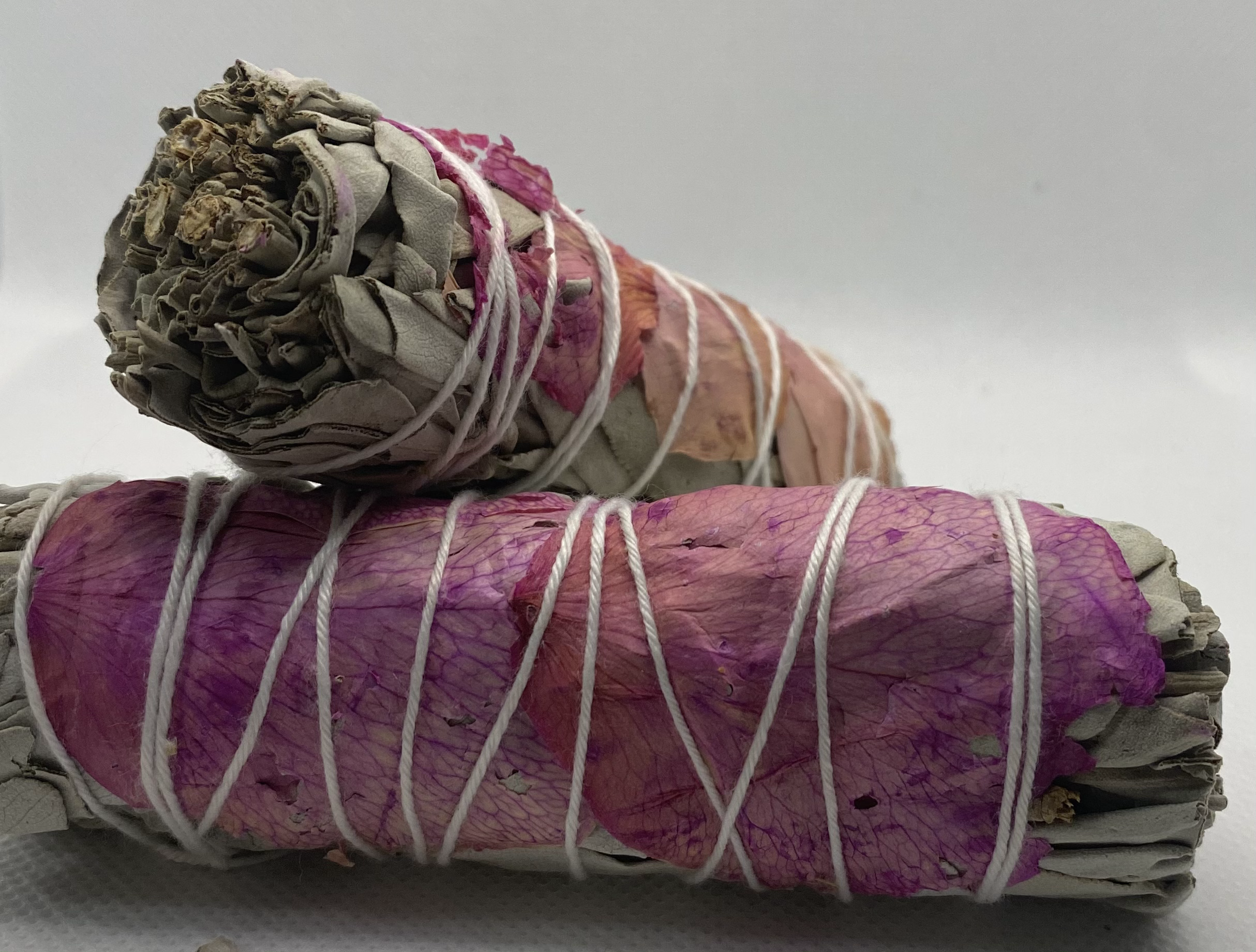 White sage wrapped with pink roses