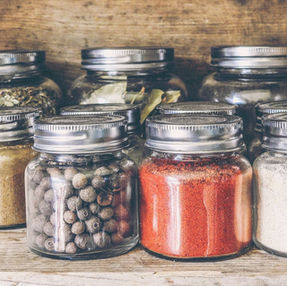 jars of spices in a cupboard