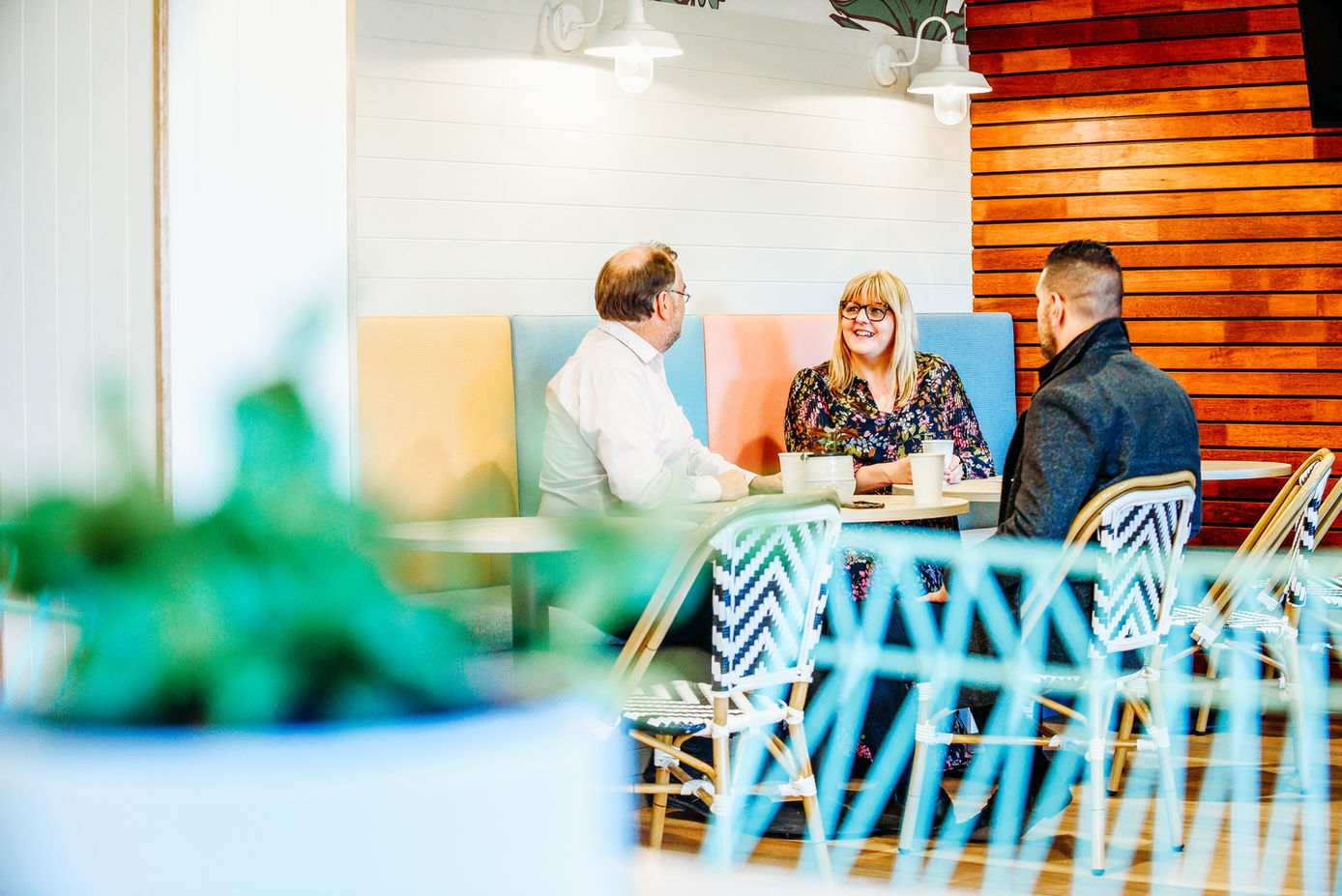 friends having a meeting inside a small cafe