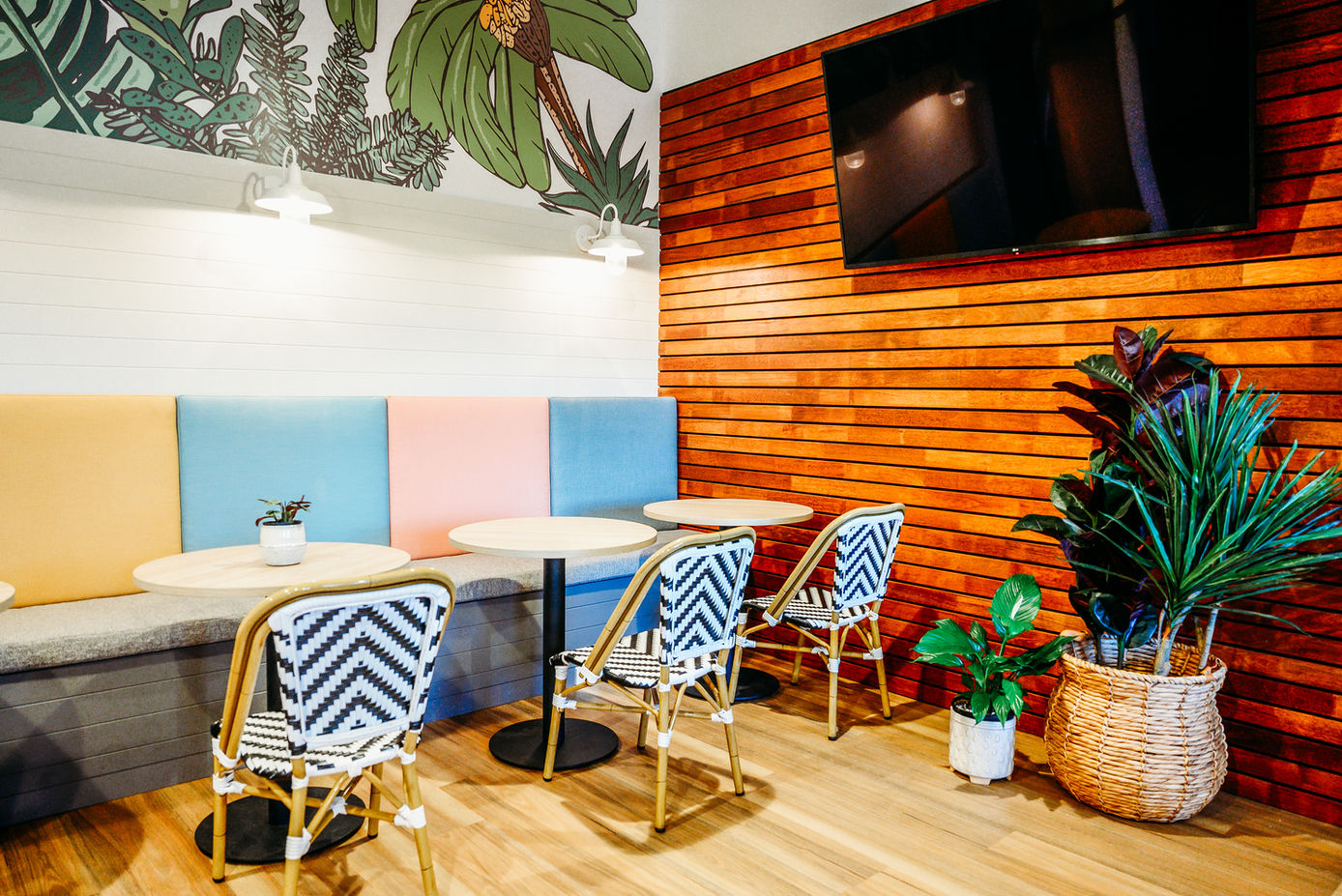 Elegant café-style setting with stylish chairs and a charming floral display