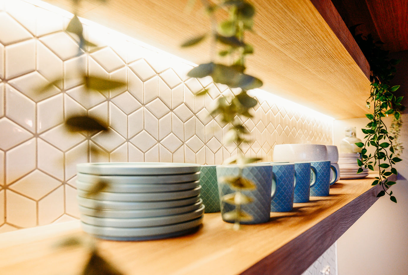 Corner display of mugs and saucers highlighted with good lighting