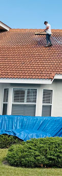 residential pressure washing - cleaning a tile roof