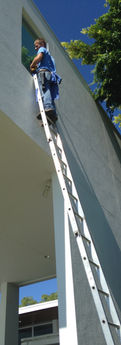 Residential window cleaning - cleaning a 2nd floor window on a home