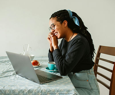 Woman experiencing more energy and better sleep after fibroid wellness coaching session online