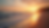 Eye-level view of a tranquil beach at sunset