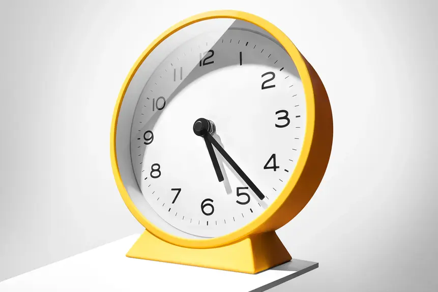 Modern yellow clock photographed in minimalist commercial product photography setup